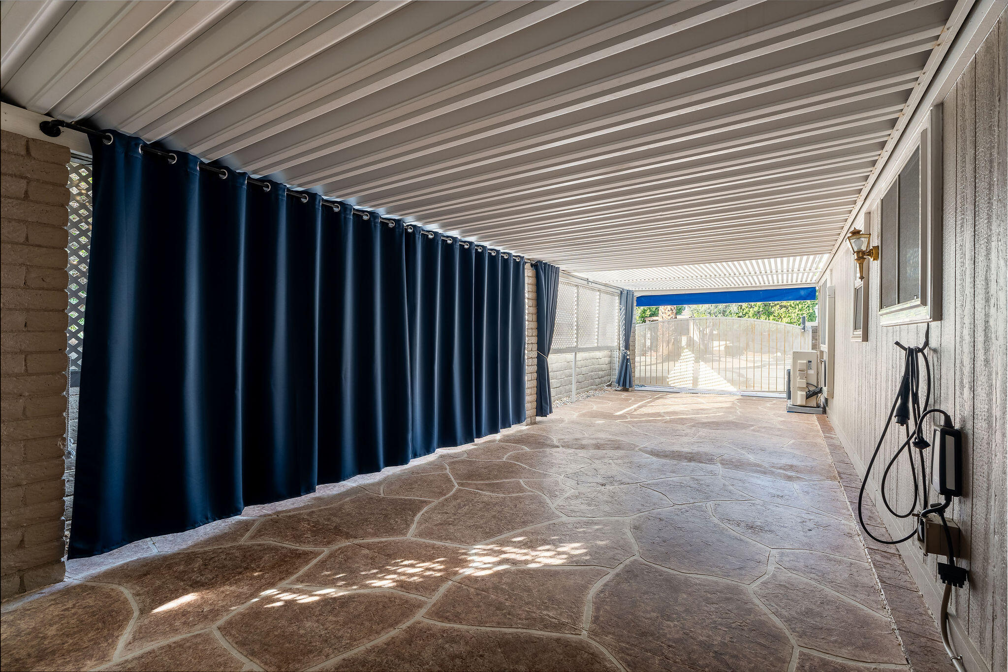 109 International Boulevard Rancho Mirage, CA 92270 - Photo 39 of 64 a view of a backyard with wooden walls