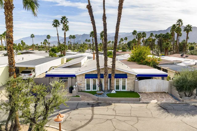 a room with pool table and a chandelier