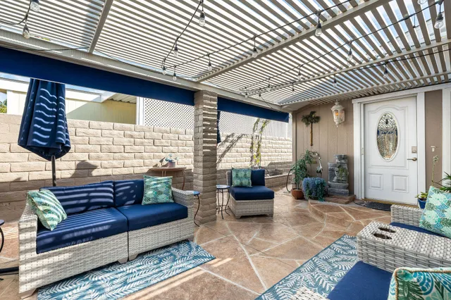 a lobby with furniture and a flat screen tv