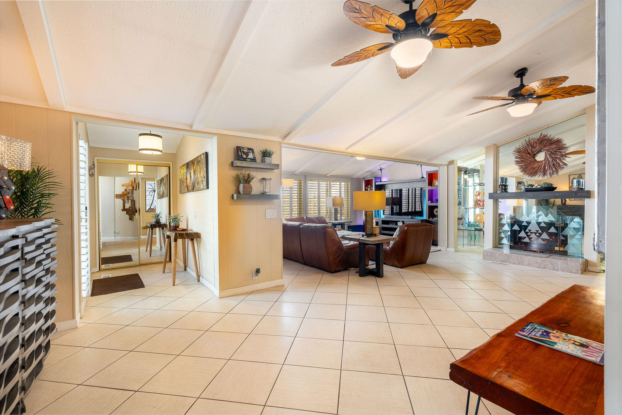 109 International Boulevard Rancho Mirage, CA 92270 - Photo 9 of 64 a living room with furniture and a flat screen tv