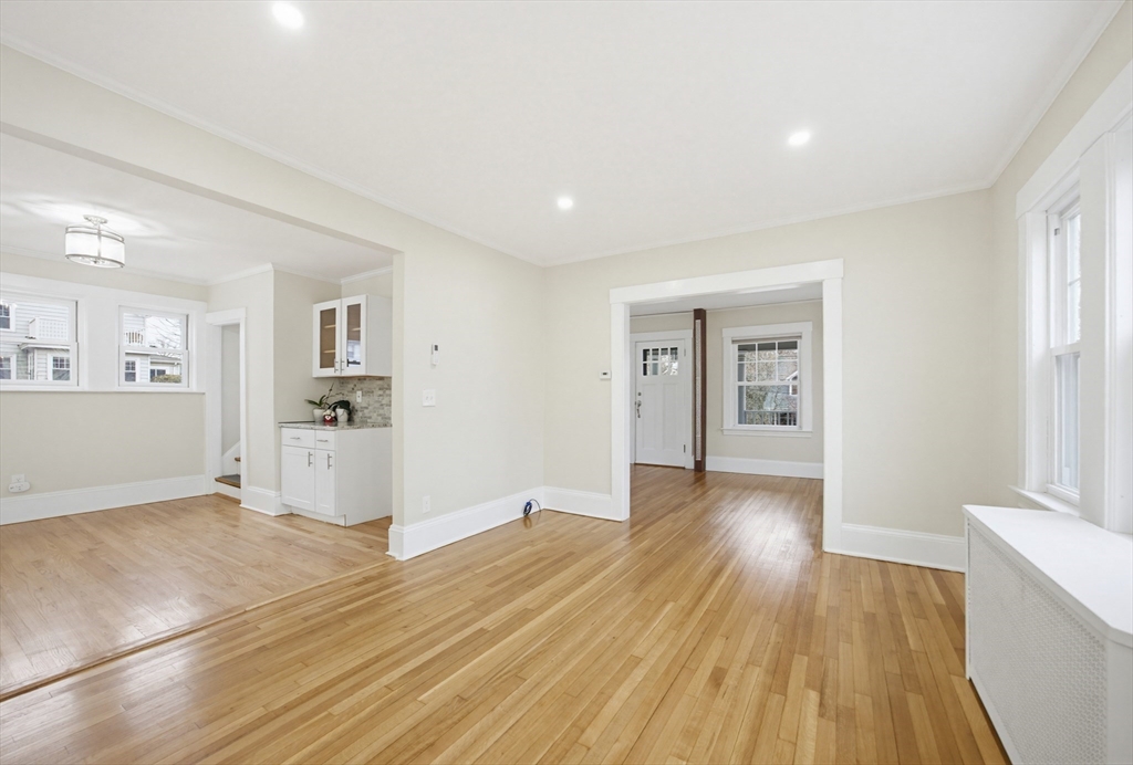 29 Shawmut Terrace Framingham, MA 01702 - Photo 16 of 42 a view of a big room with wooden floor and windows