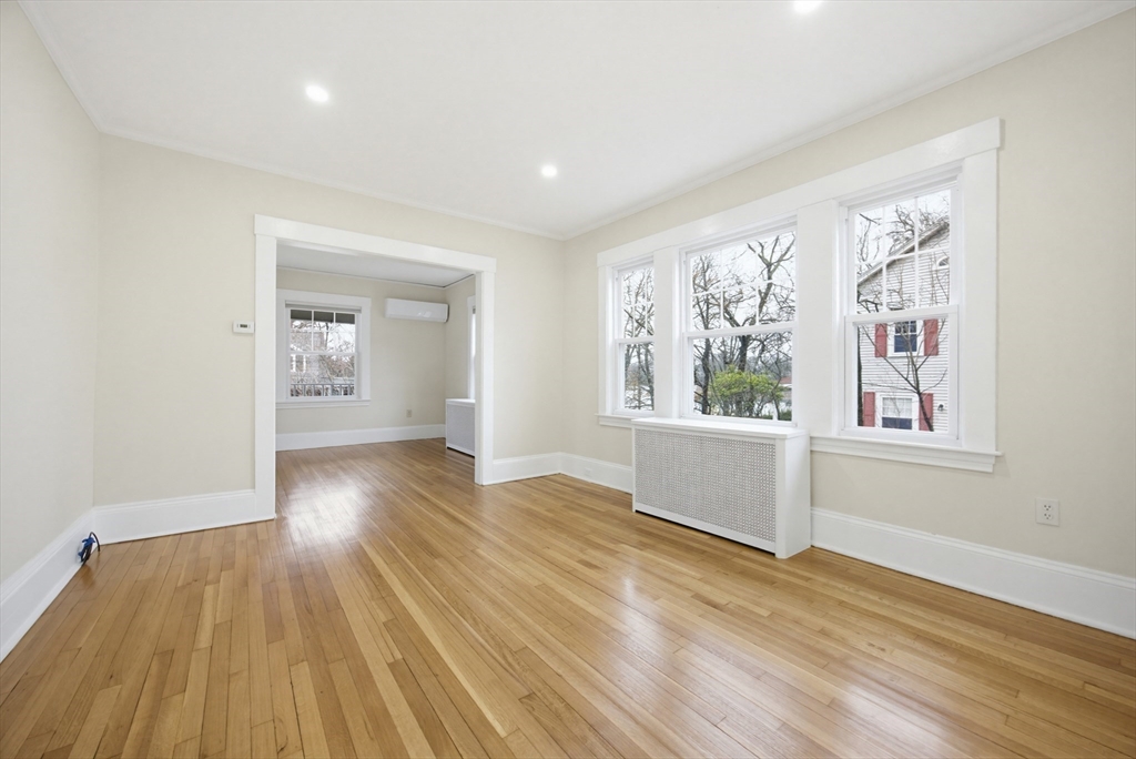 29 Shawmut Terrace Framingham, MA 01702 - Photo 20 of 42 a view of an empty room with wooden floor and a window