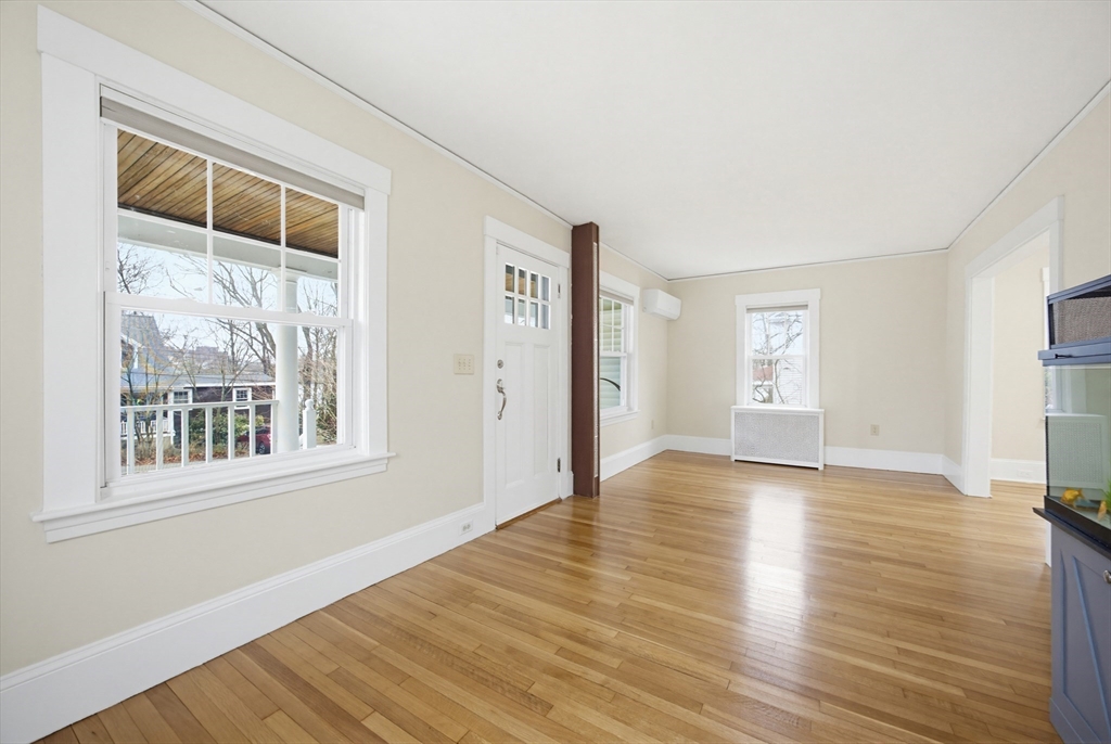 29 Shawmut Terrace Framingham, MA 01702 - Photo 21 of 42 a view of an empty room with wooden floor and a window