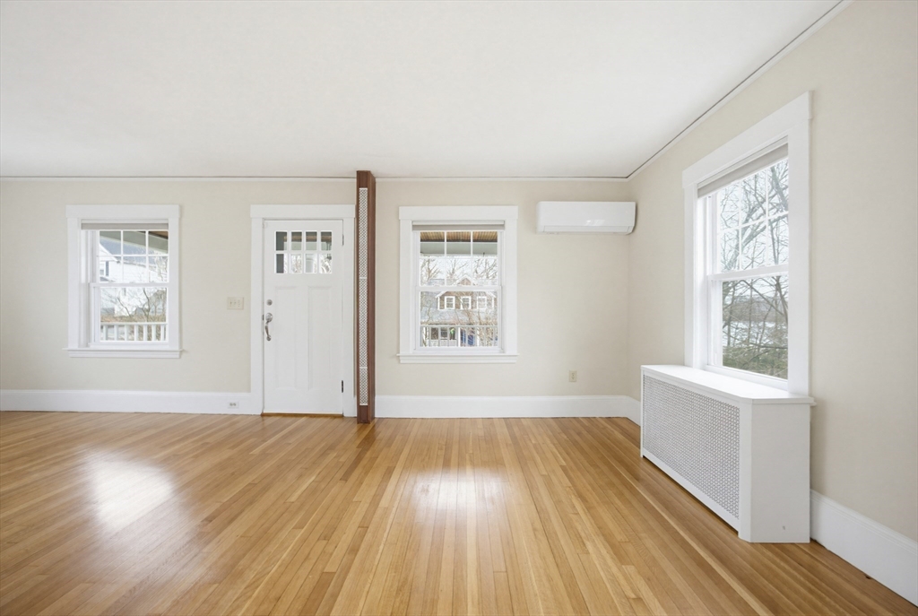 29 Shawmut Terrace Framingham, MA 01702 - Photo 23 of 42 a view of an empty room with wooden floor and a window