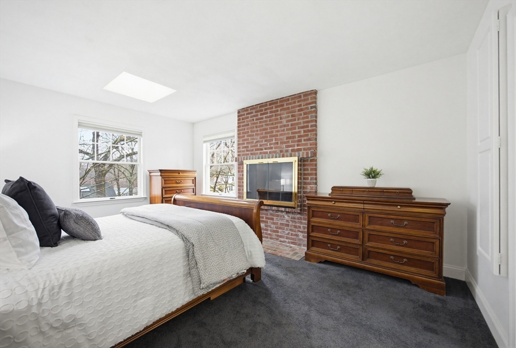 29 Shawmut Terrace Framingham, MA 01702 - Photo 25 of 42 a bedroom with a bed and a television