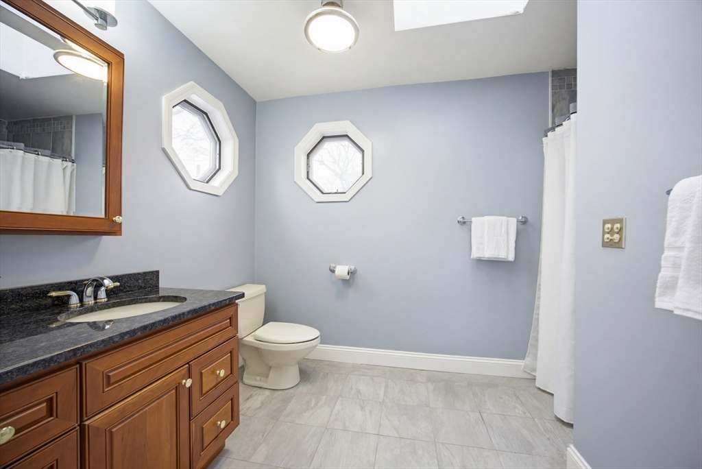 29 Shawmut Terrace Framingham, MA 01702 - Photo 27 of 42 a bathroom with a toilet a sink and a mirror