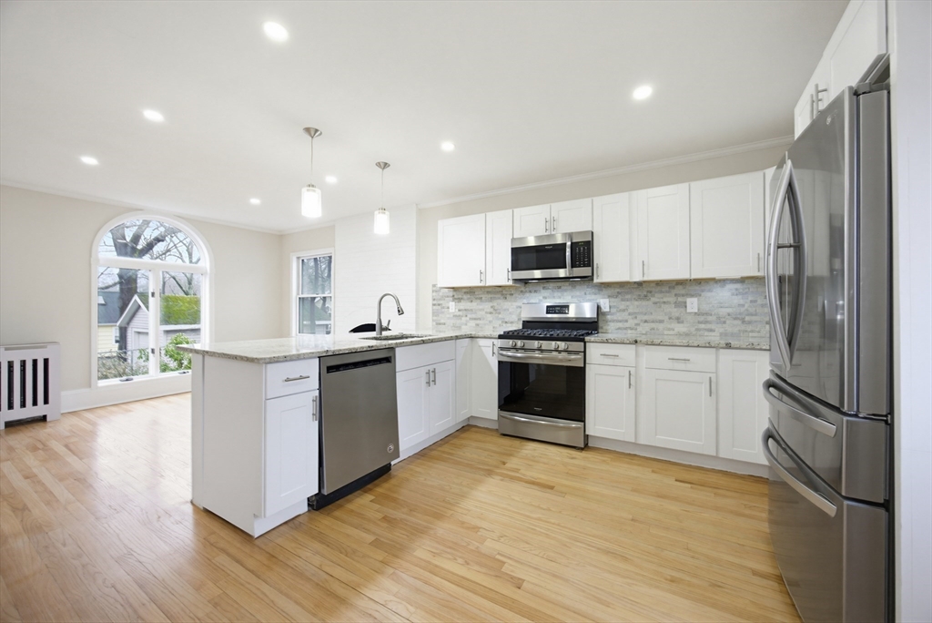29 Shawmut Terrace Framingham, MA 01702 - Photo 3 of 42 a kitchen with a refrigerator stove top oven and sink