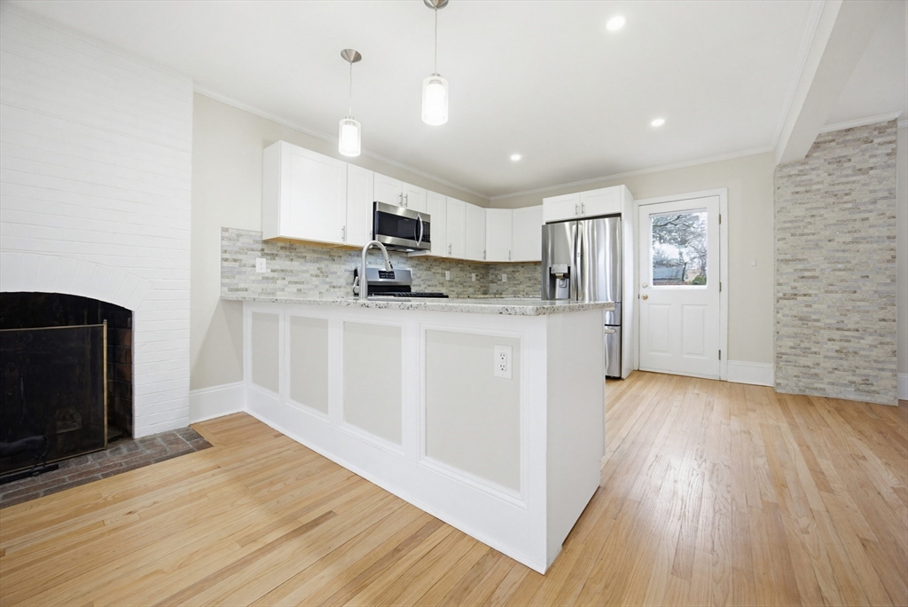 29 Shawmut Terrace Framingham, MA 01702 - Photo 9 of 42 a kitchen with stainless steel appliances a refrigerator sink and microwave