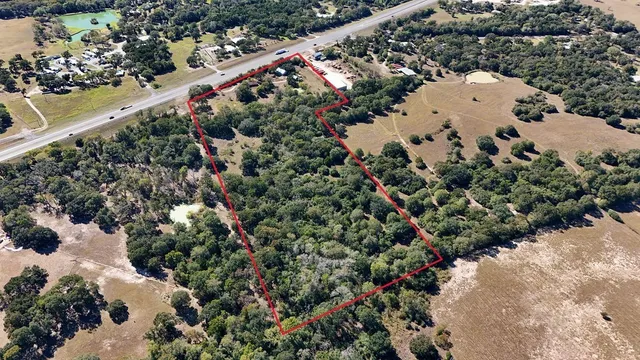 an aerial view of house with yard