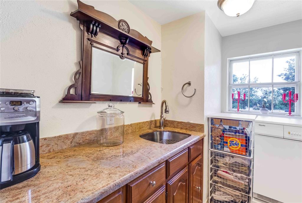 216 McMillen Road Lucas, TX 75002 - Photo 14 of 36 a kitchen with stainless steel appliances granite countertop a sink and a refrigerator