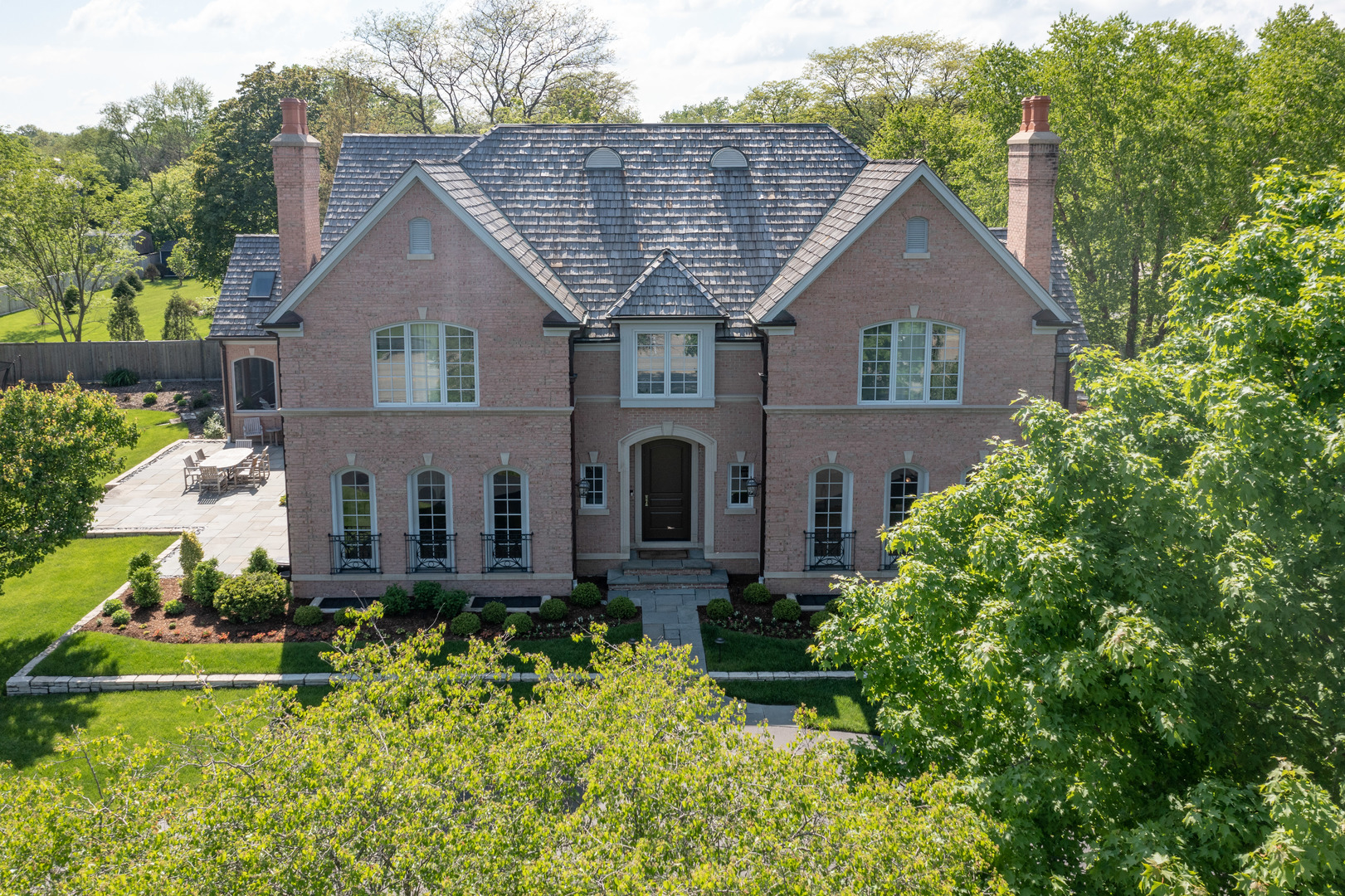 front view of a house with a yard