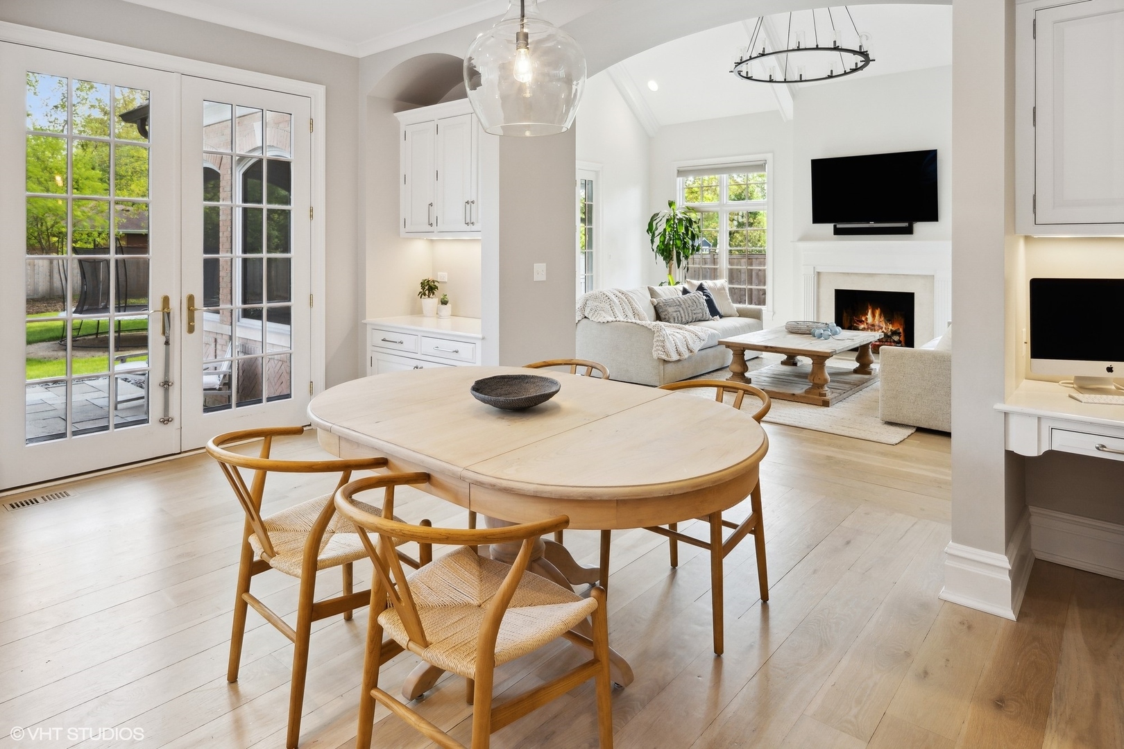 480 Wagner Road Northfield, IL 60093 - Photo 14 of 53 a view of a dining room with furniture and a flat screen tv