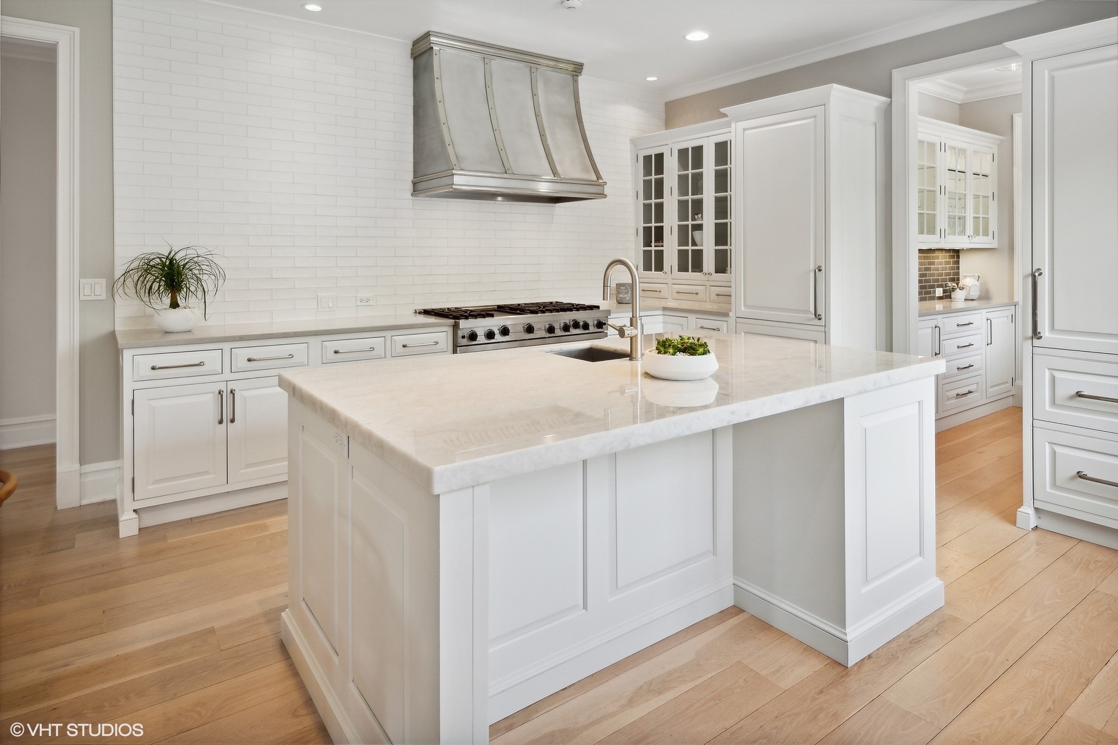 480 Wagner Road Northfield, IL 60093 - Photo 16 of 53 a kitchen with stainless steel appliances white cabinets and wooden floor