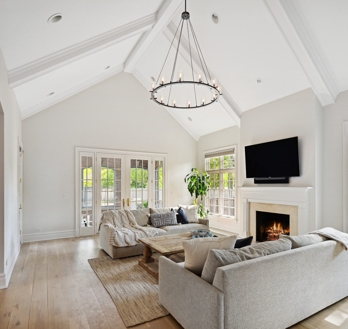 480 Wagner Road Northfield, IL 60093 - Photo 17 of 53 a living room with furniture a flat screen tv and a fireplace