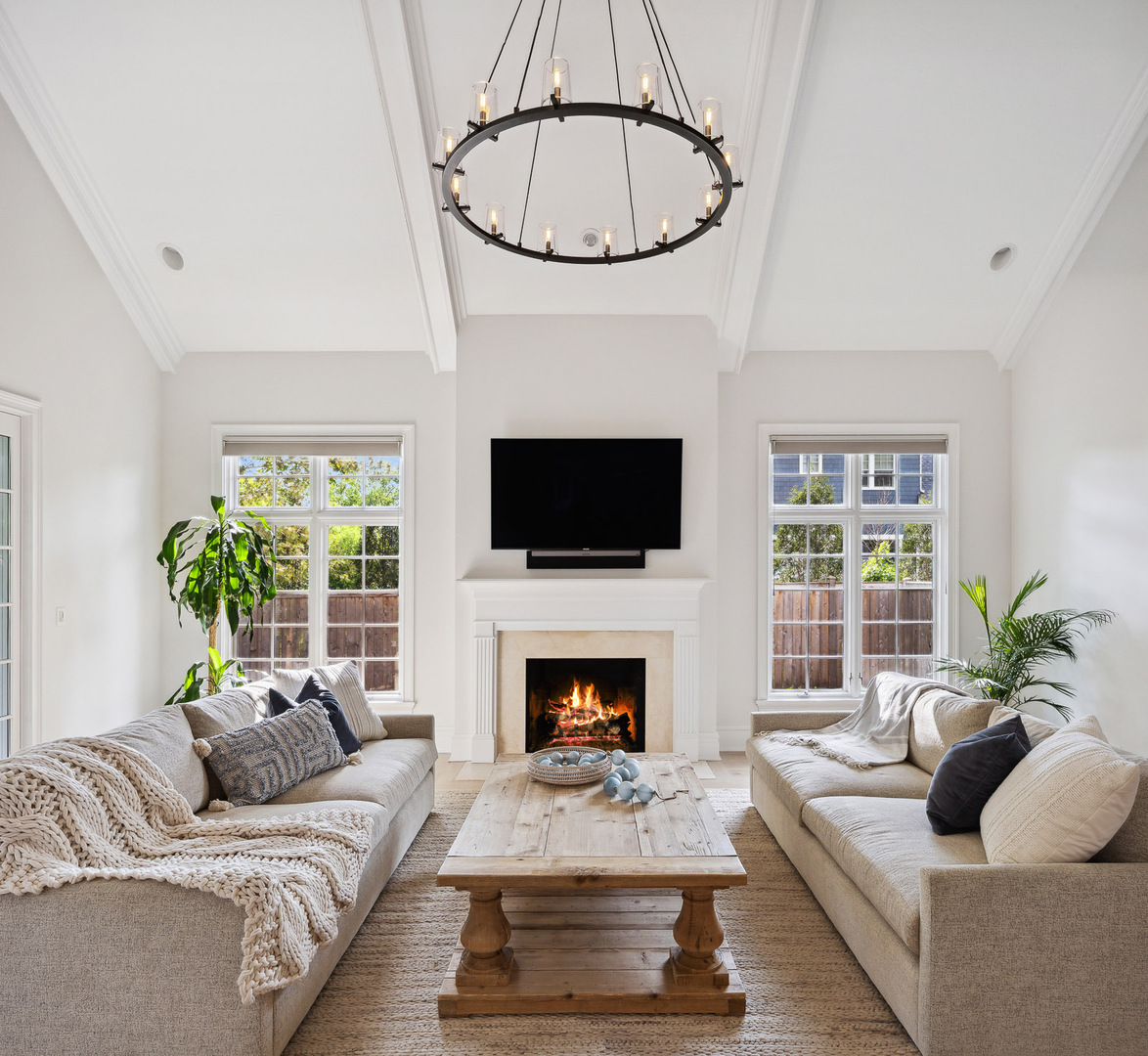 480 Wagner Road Northfield, IL 60093 - Photo 18 of 53 a living room with furniture a fireplace and a flat screen tv
