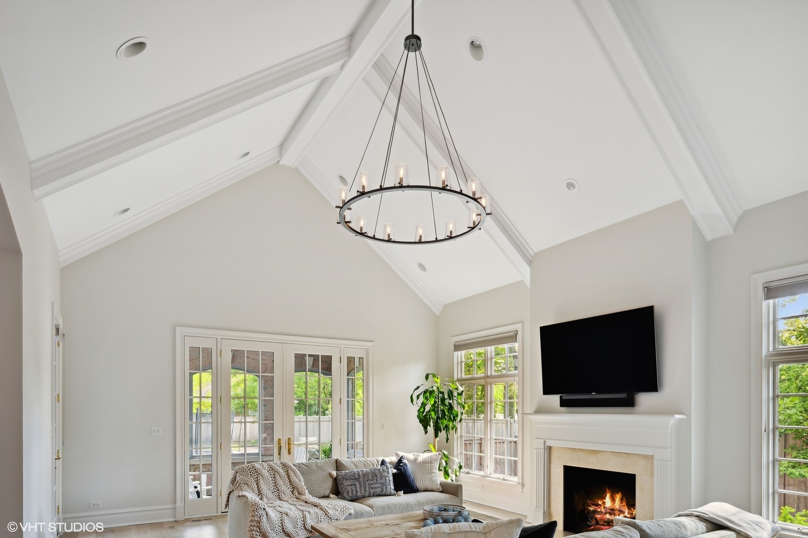 480 Wagner Road Northfield, IL 60093 - Photo 19 of 53 a living room with furniture a flat screen tv and a fireplace