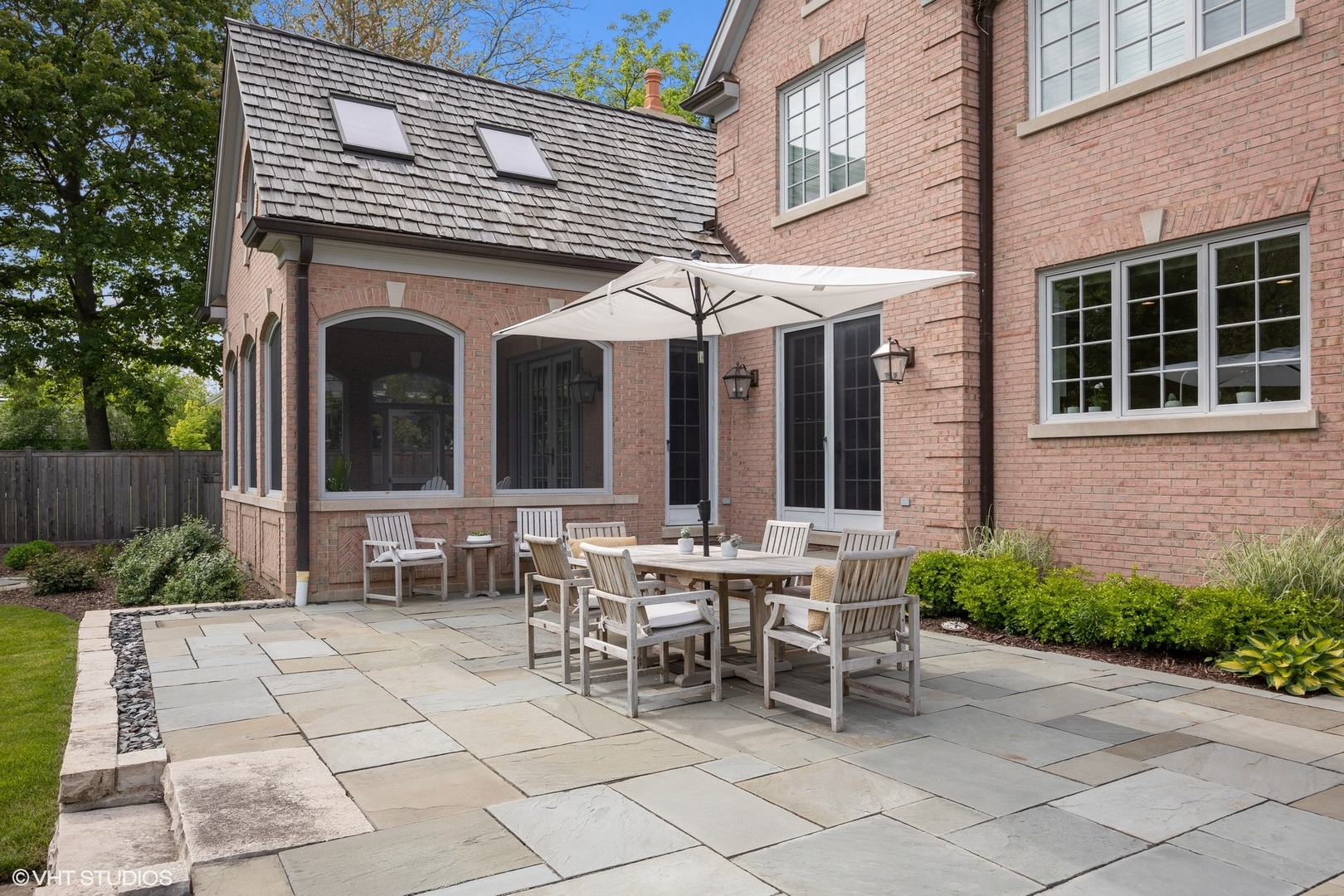 480 Wagner Road Northfield, IL 60093 - Photo 23 of 53 a view of a patio with table and chairs and potted plants