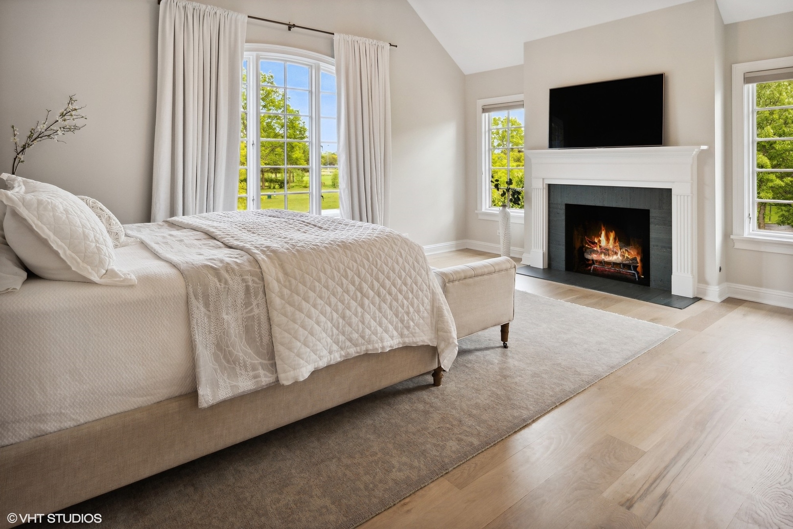 480 Wagner Road Northfield, IL 60093 - Photo 28 of 53 a bed sitting in a bedroom next to a window with a fireplace