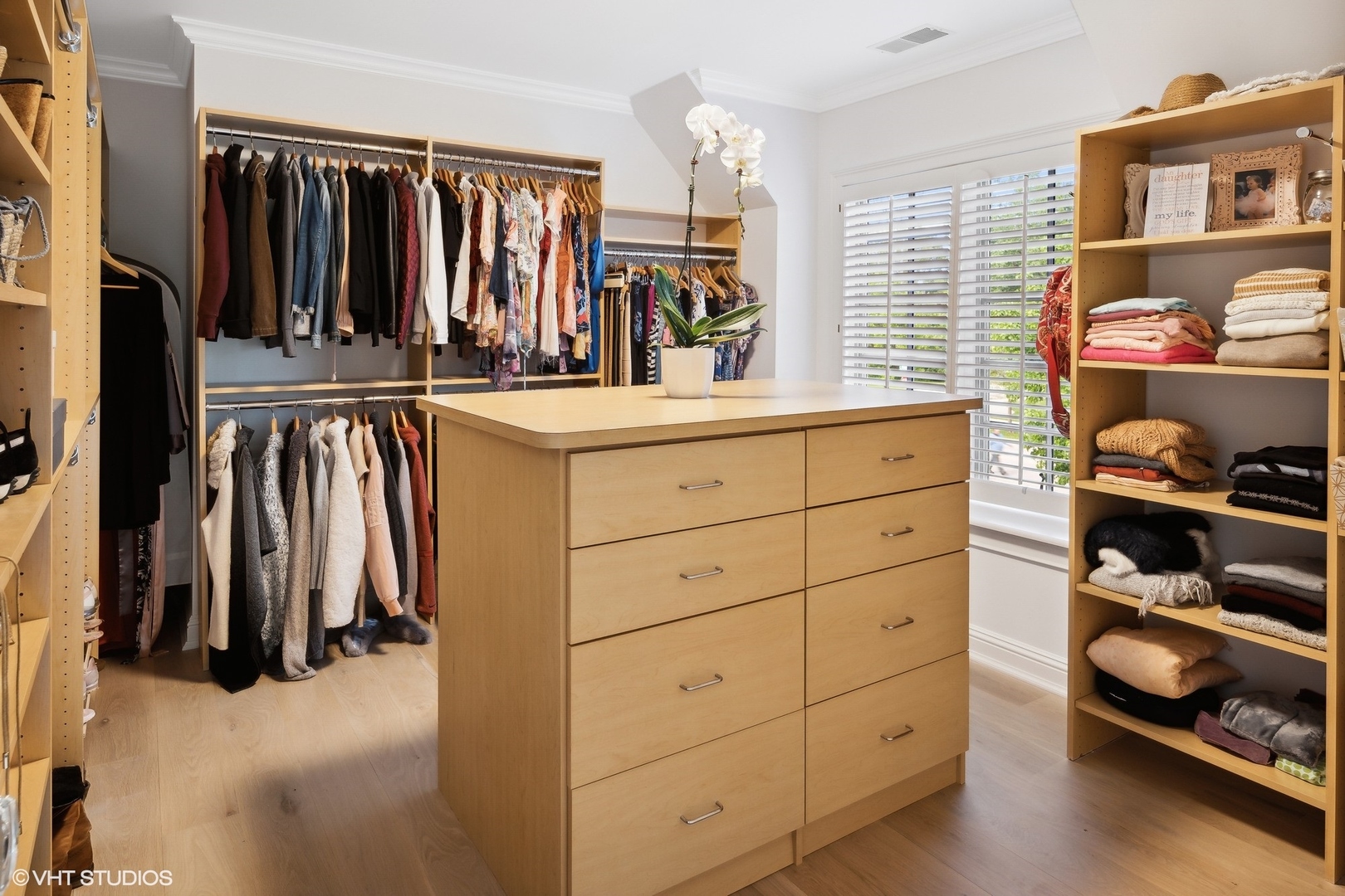480 Wagner Road Northfield, IL 60093 - Photo 31 of 53 a view of walk in closet with clothes and shoes