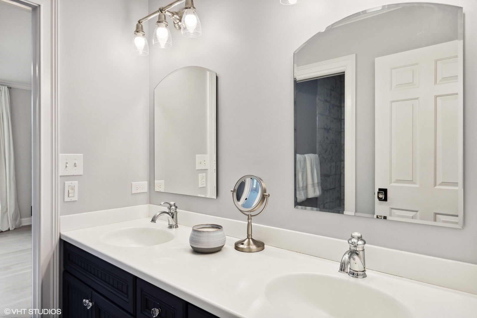 480 Wagner Road Northfield, IL 60093 - Photo 35 of 53 a bathroom with double vanity sinks and a mirror