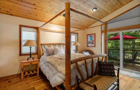 a bedroom with furniture and a window