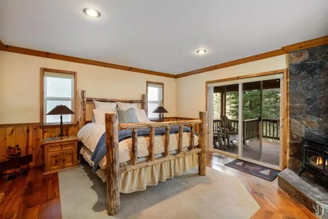 a bed room with furniture and a flat screen tv