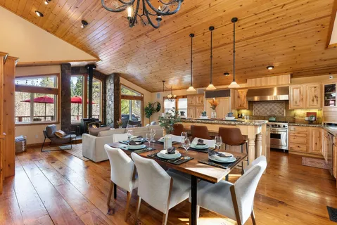 a dining room with lots of wooden furniture