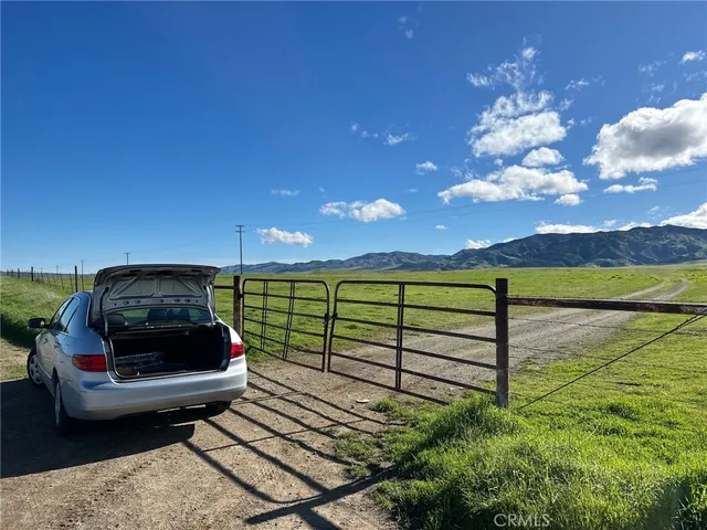a roof deck with table and chairs