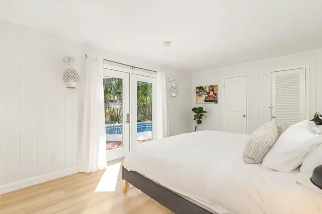 a large white bed in a white room