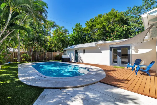 a view of a backyard with a patio