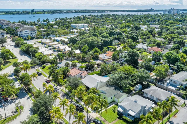 an aerial view of a house with a yard and outdoor seating