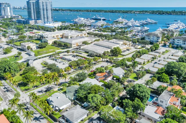 an aerial view of residential house with outdoor space and trees all around