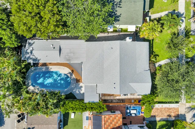 an aerial view of residential houses with outdoor space
