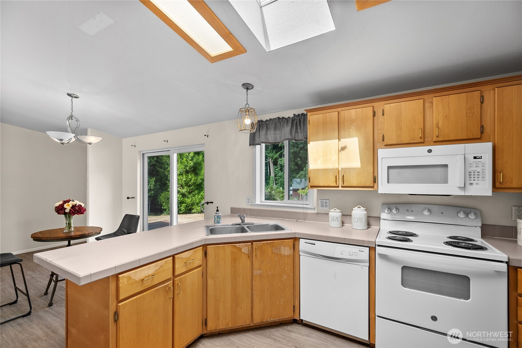 1870 Northwest Vaa Road Poulsbo, WA 98370 - Photo 11 of 40 a kitchen with stainless steel appliances a sink stove and window