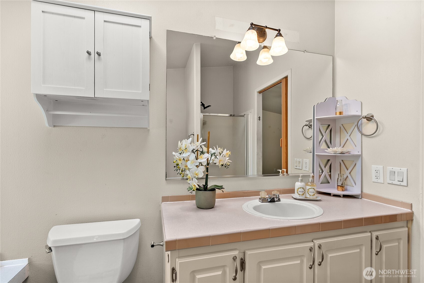 1870 Northwest Vaa Road Poulsbo, WA 98370 - Photo 21 of 40 a bathroom with a sink and a mirror with toilet