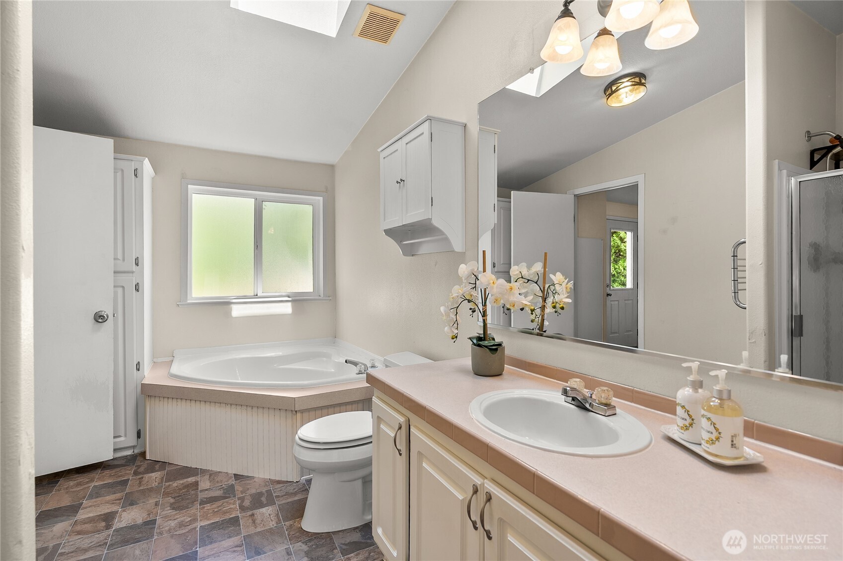 1870 Northwest Vaa Road Poulsbo, WA 98370 - Photo 22 of 40 a bathroom with a granite countertop bathtub sink vanity mirror and toilet