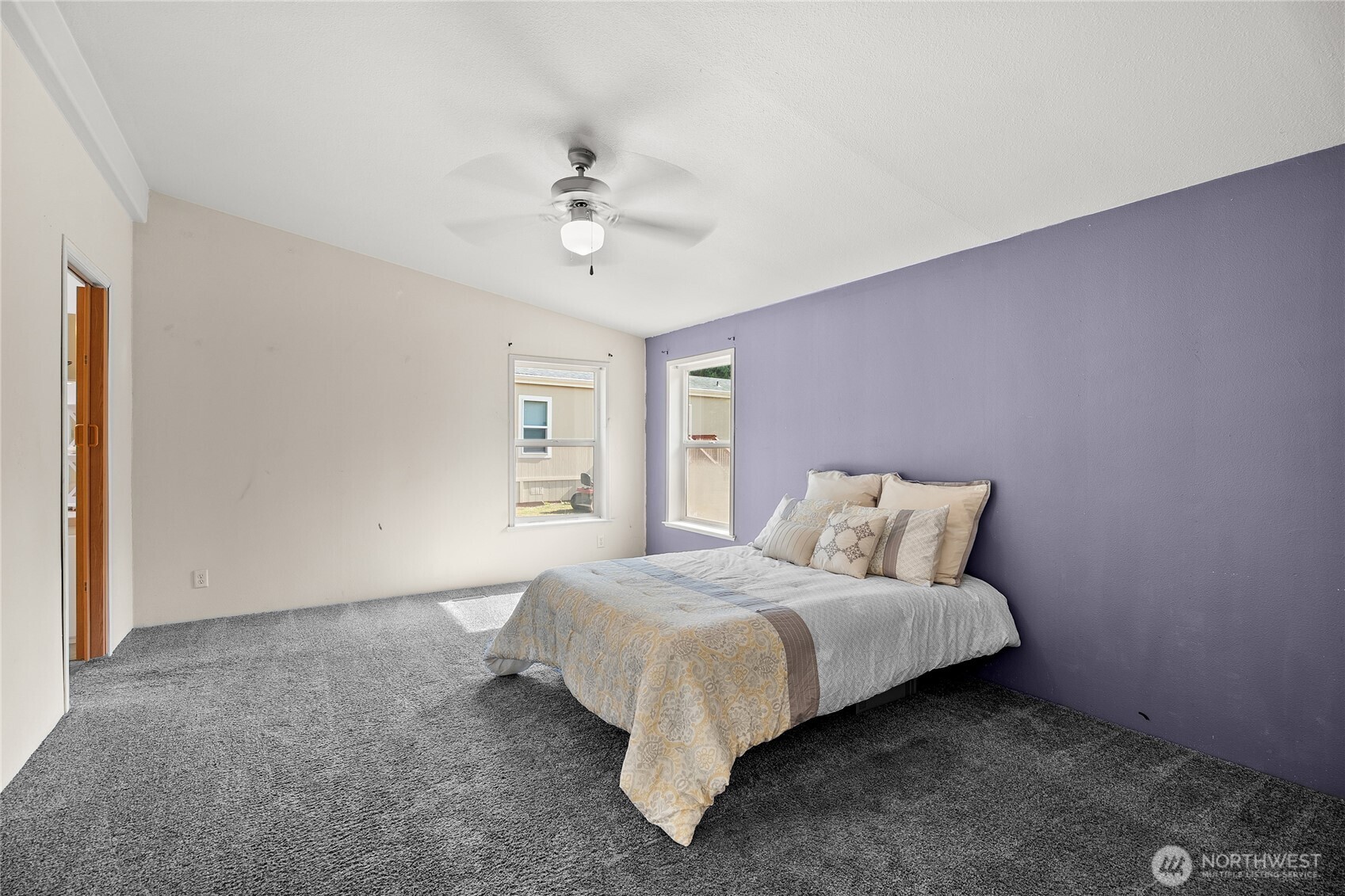 1870 Northwest Vaa Road Poulsbo, WA 98370 - Photo 24 of 40 a bed room with a bed and a chandelier