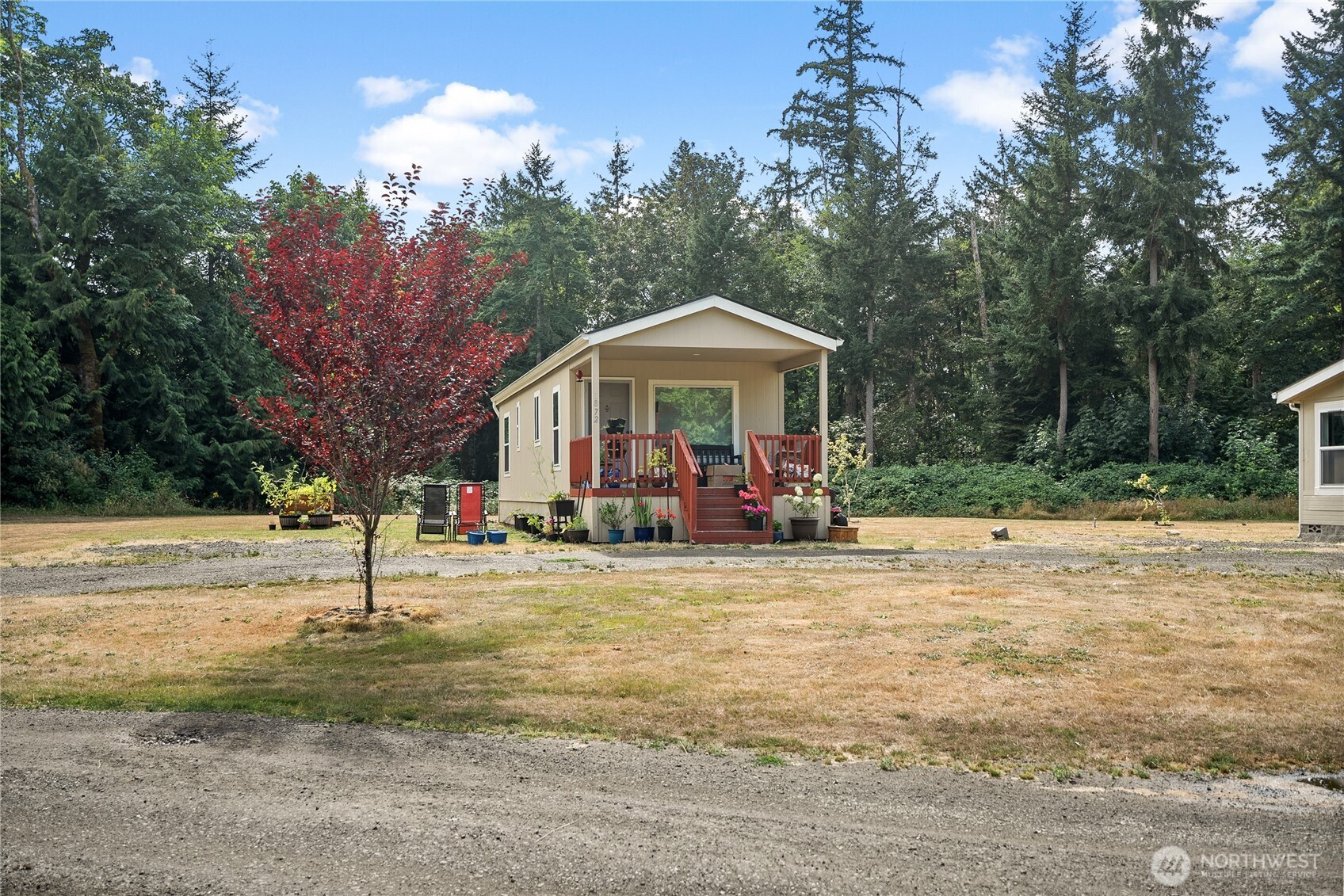 1870 Northwest Vaa Road Poulsbo, WA 98370 - Photo 3 of 40 a view of a house with a yard and tree s
