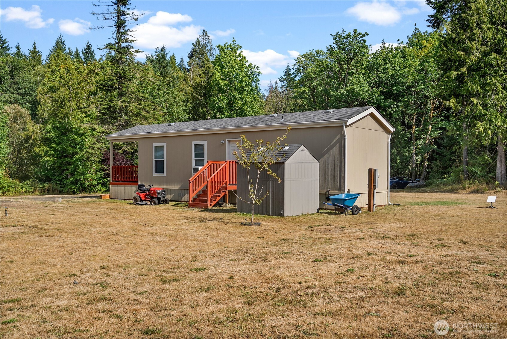 1870 Northwest Vaa Road Poulsbo, WA 98370 - Photo 7 of 40 a view of a house with backyard and trees