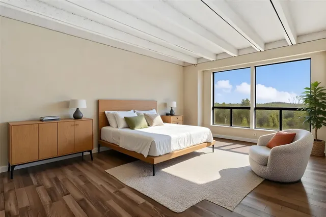 a spacious bedroom with a bed and a couch