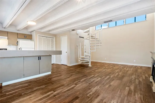 a view of a kitchen with a sink and cabinets