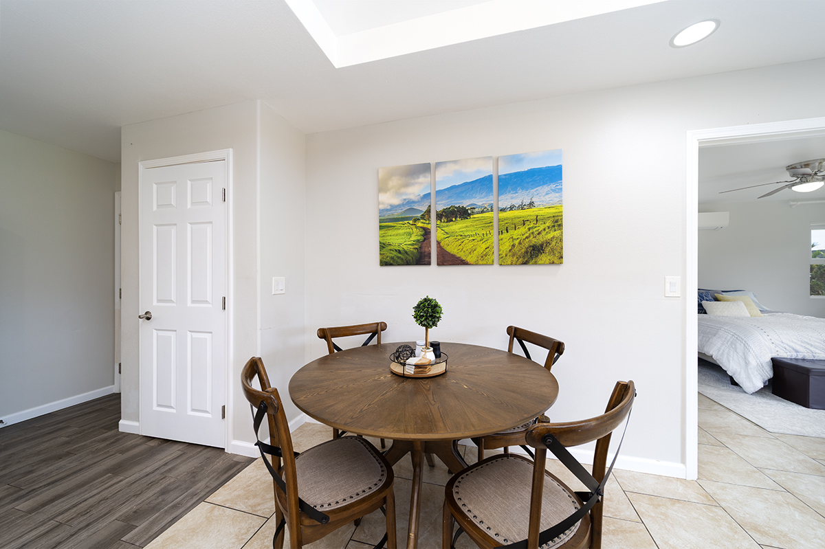 189 Noelani Loop, Unit 1 Hilo, HI 96720 - Photo 5 of 29 a view of a dining room with furniture and wooden floor