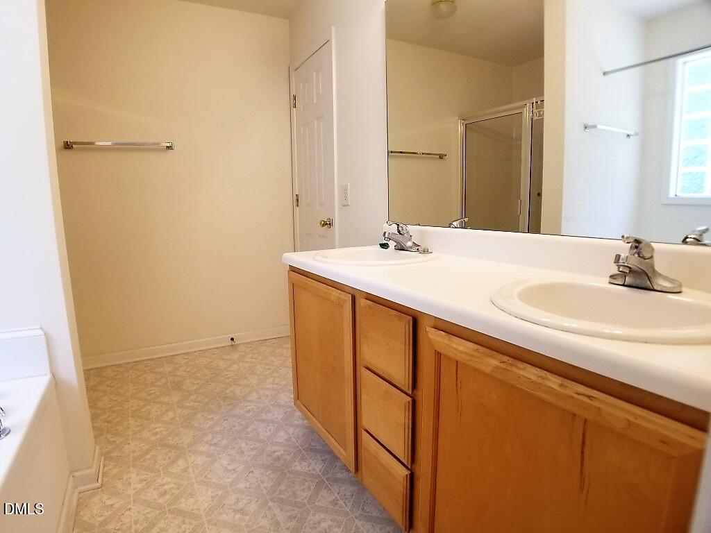 2100 Ramsgate Street Raleigh, NC 27603 - Photo 11 of 13 a bathroom with a sink and a mirror
