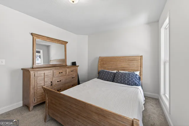 a bedroom with a bed and a cabinets