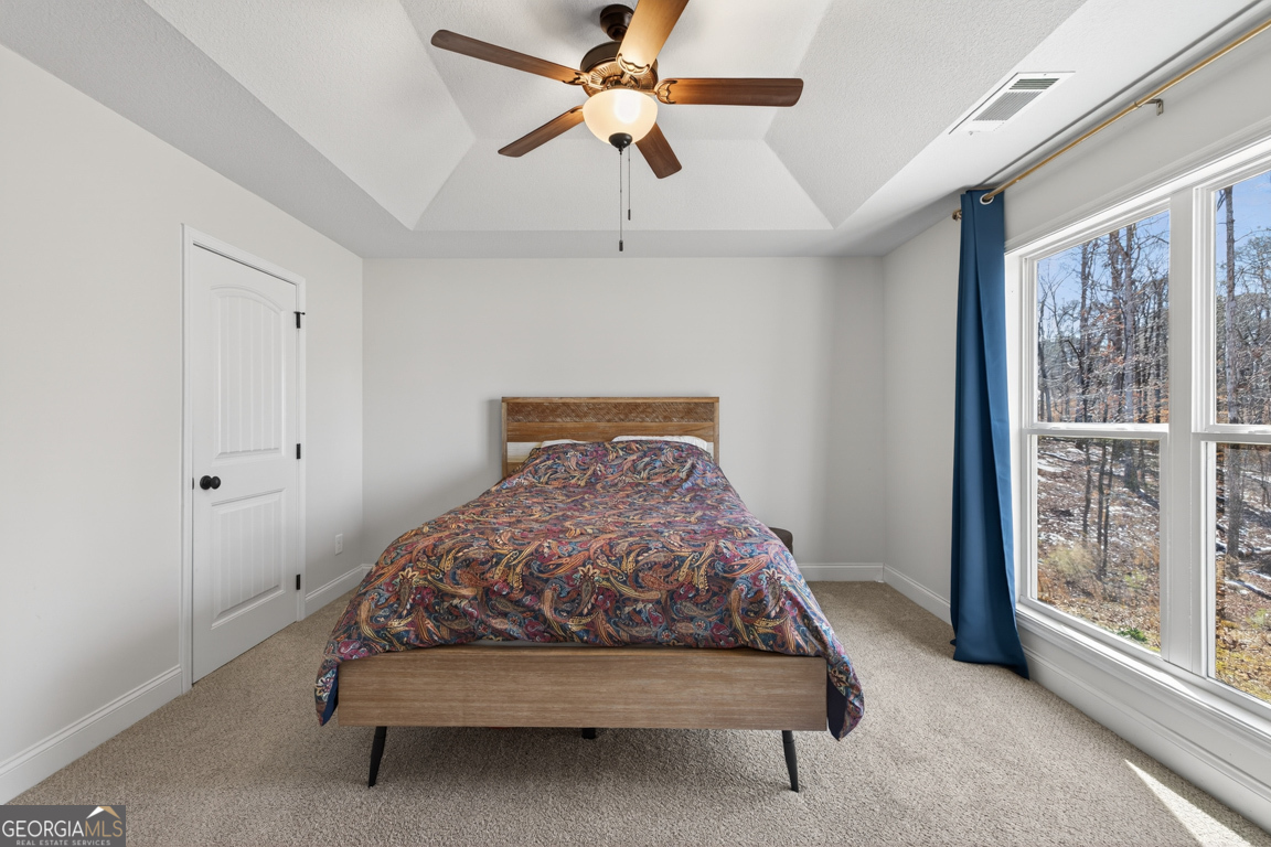 142 Rolling Wds Lane, Unit 29 Colbert, GA 30628 - Photo 29 of 34 a bedroom with a bed and window