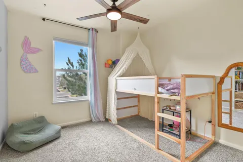 a bedroom with furniture and a baby crib