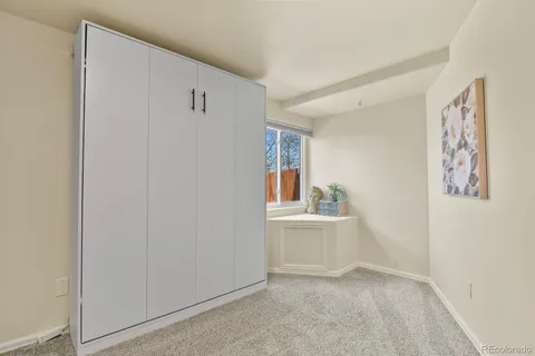 a view of livingroom with furniture and cabinet