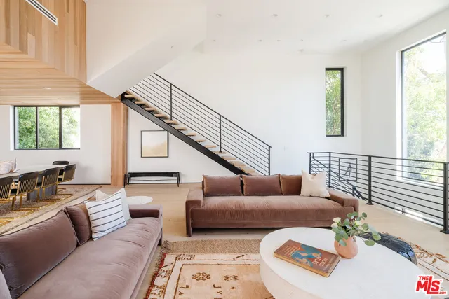 a bedroom with bed and a couch