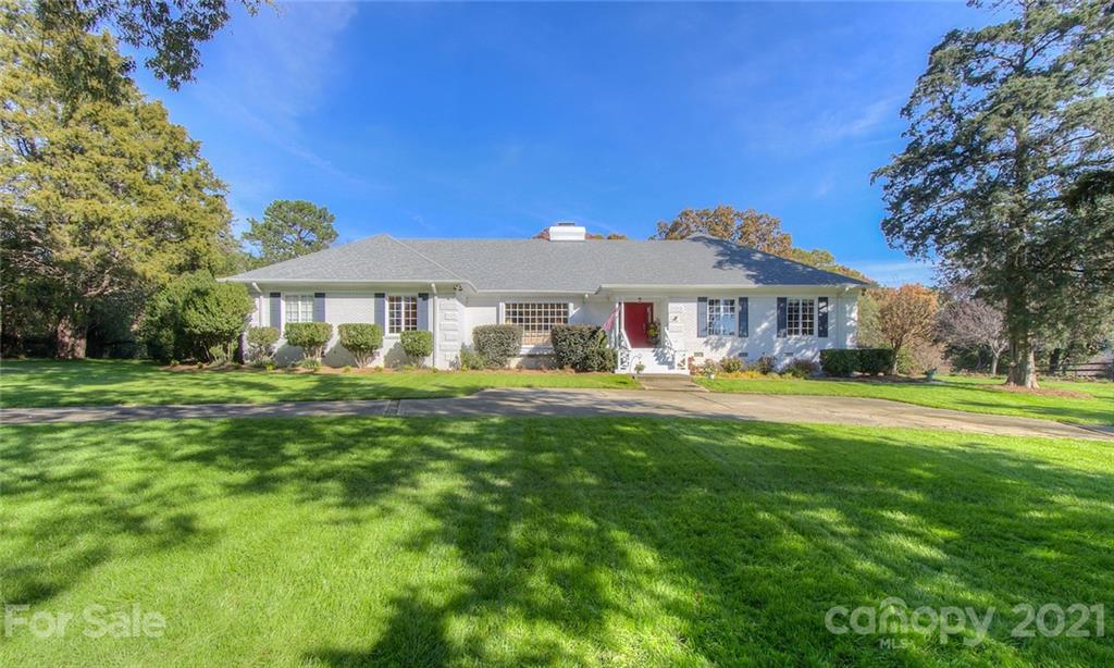 a front view of a house with a yard table and chairs