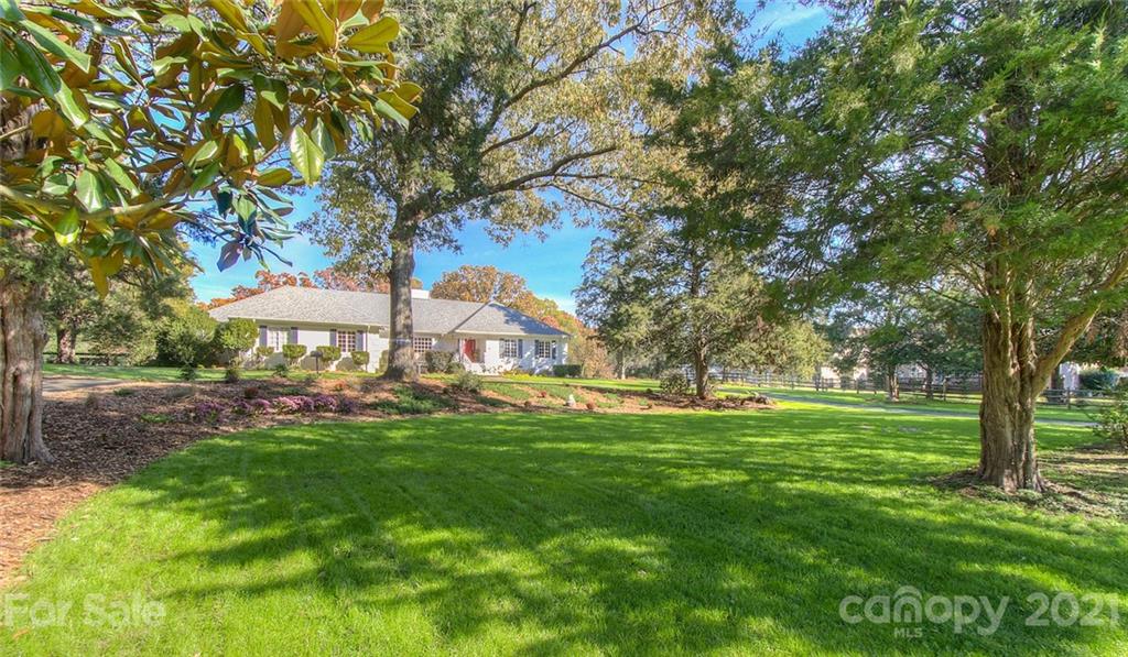 6955 Old Providence Road Charlotte, NC 28226 - Photo 2 of 44 a view of a park with large trees